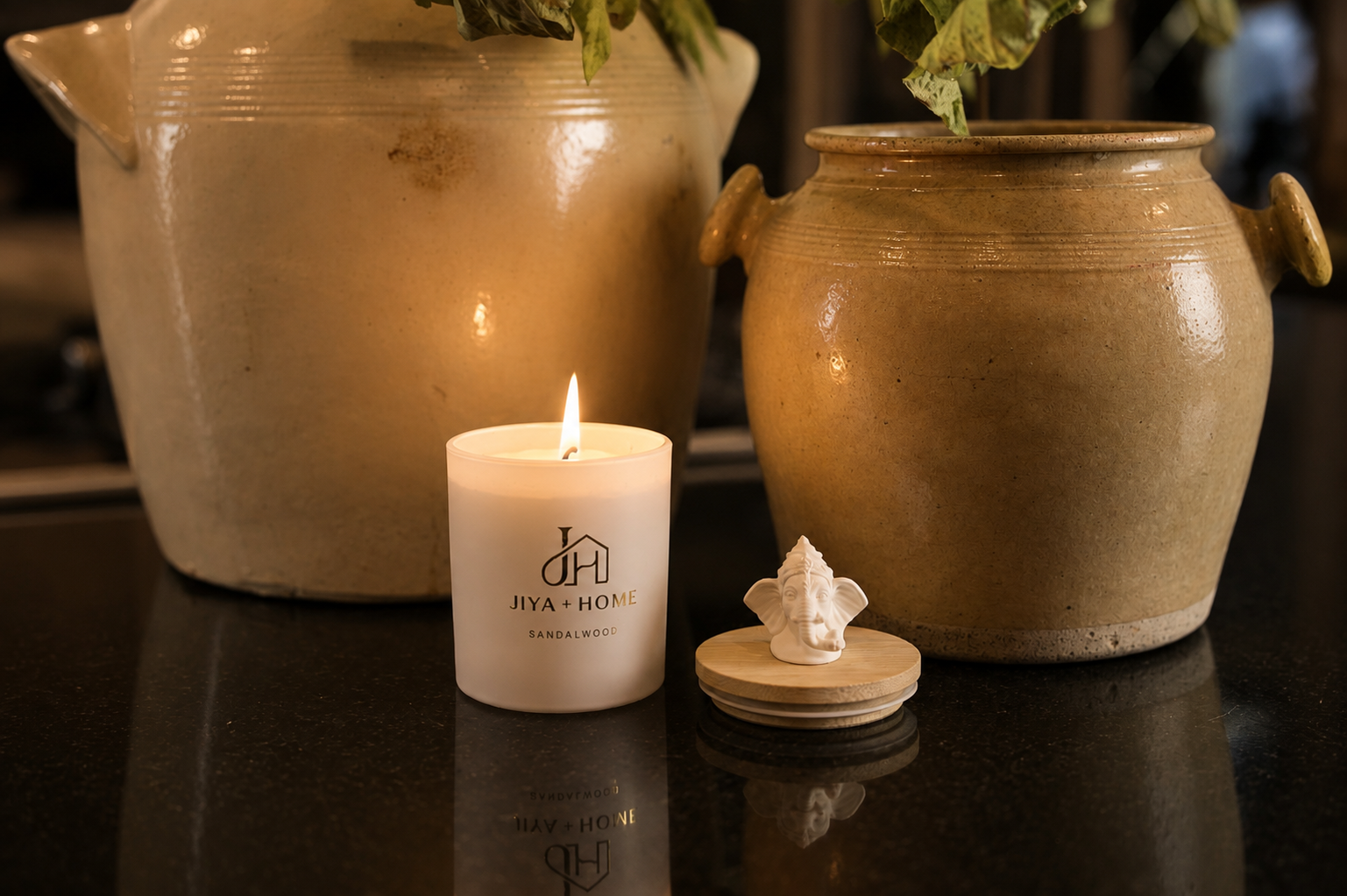 A Jiya and Home candle revealing its porcelain keepsake