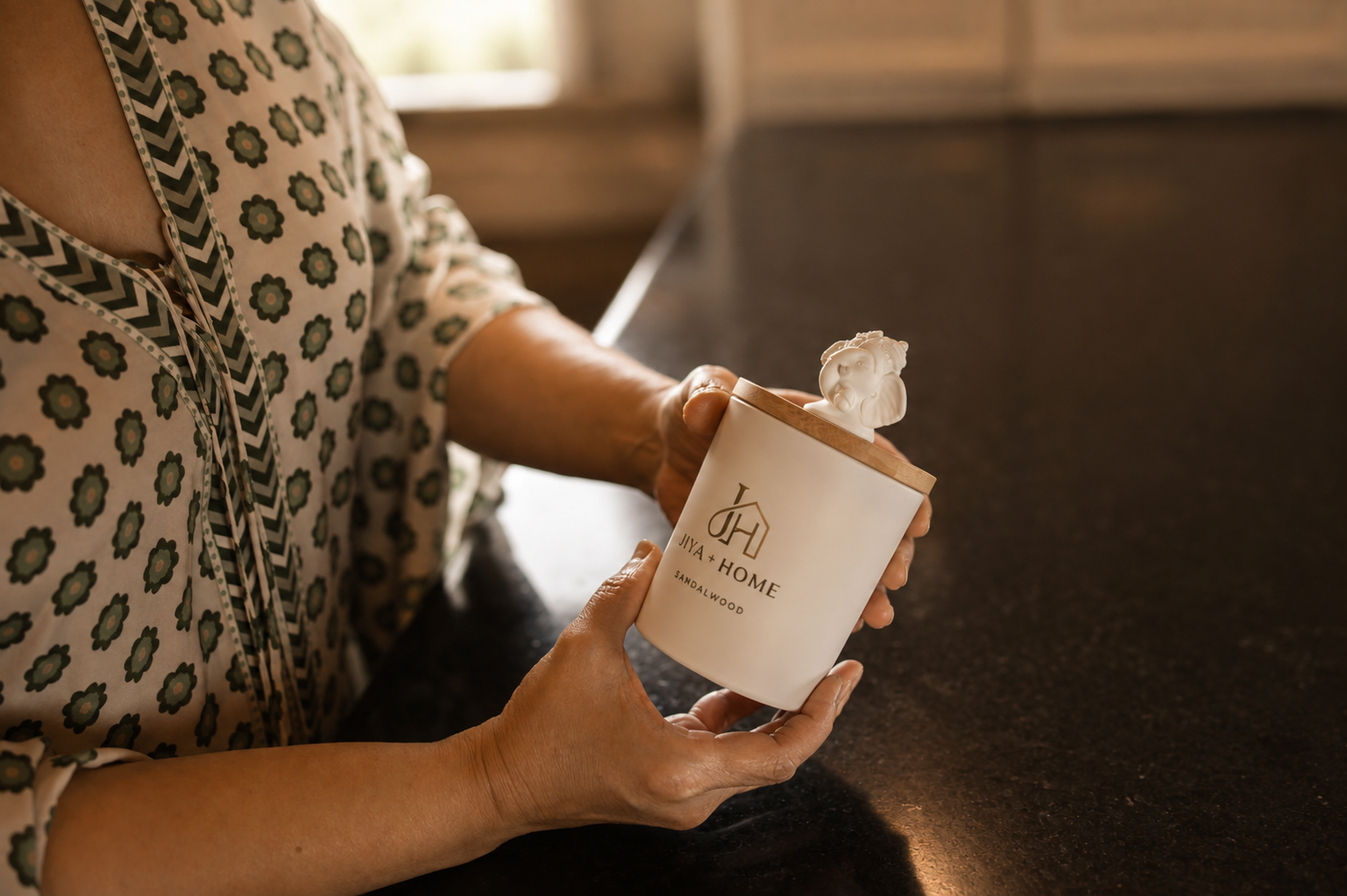 Jiya and Home candle in a styled home setting